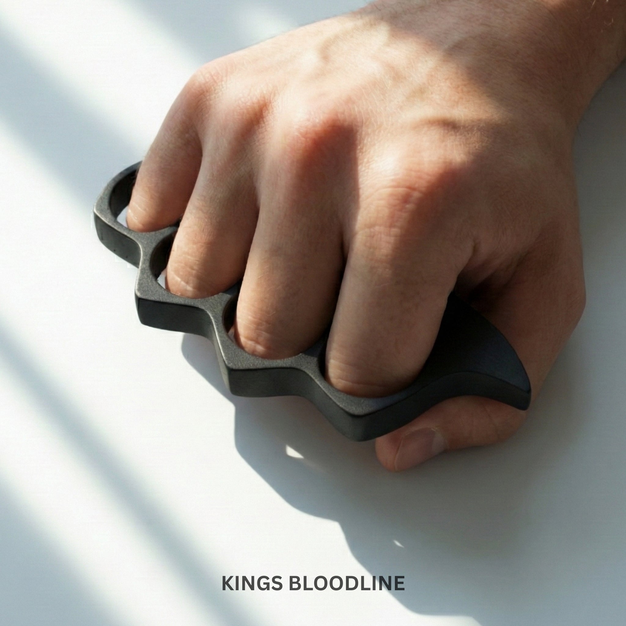 Black metal knuckle on hands