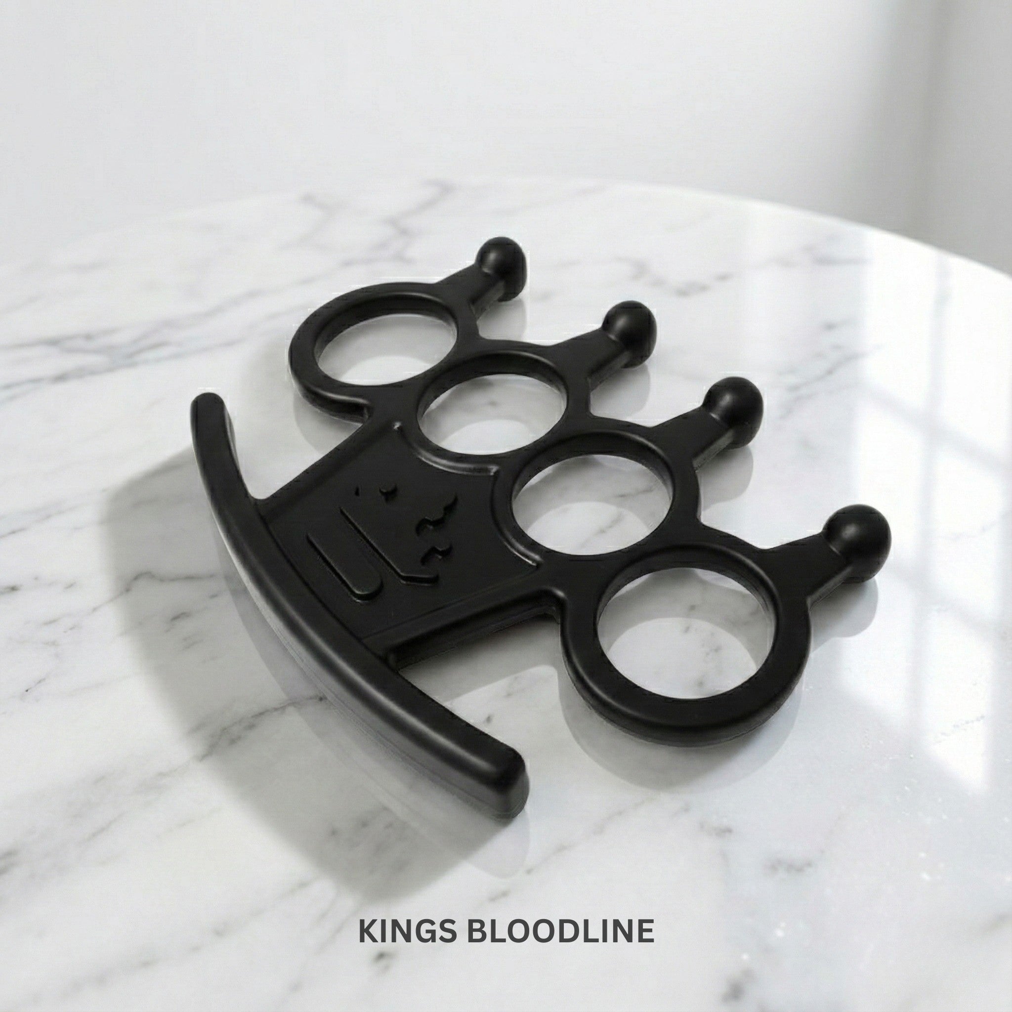 Black knuckle on white marble surface side view