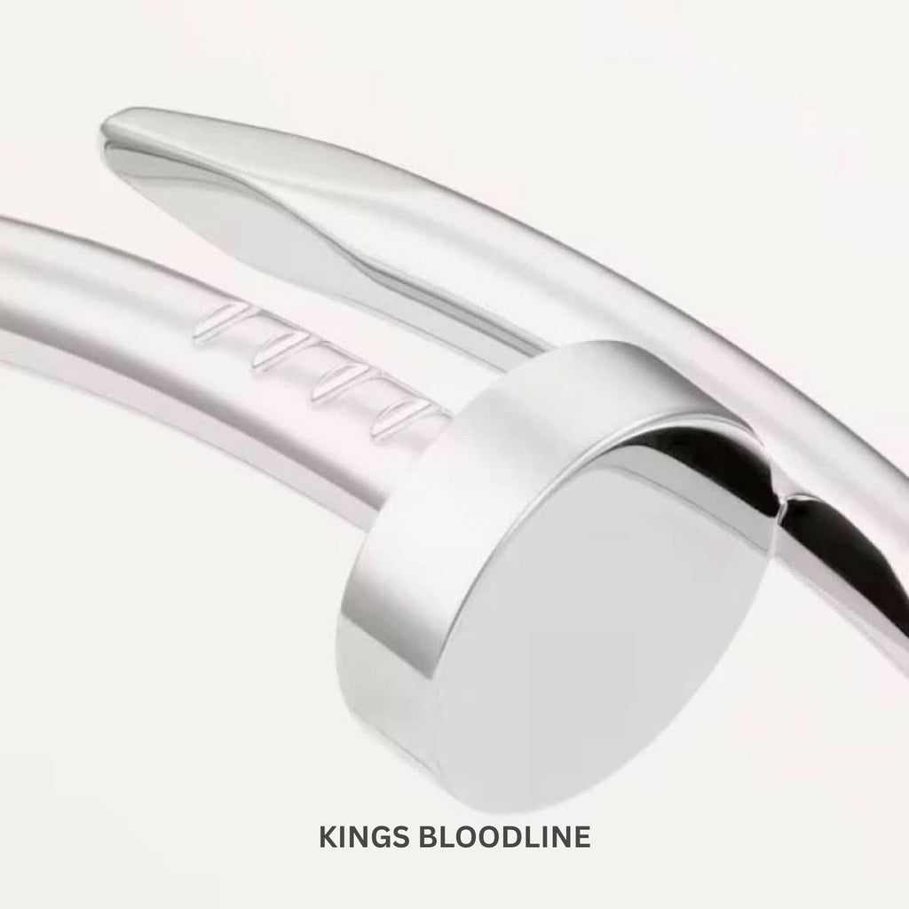 Close-up of a silver bracelet with 'Kings Bloodline' branding on a white background