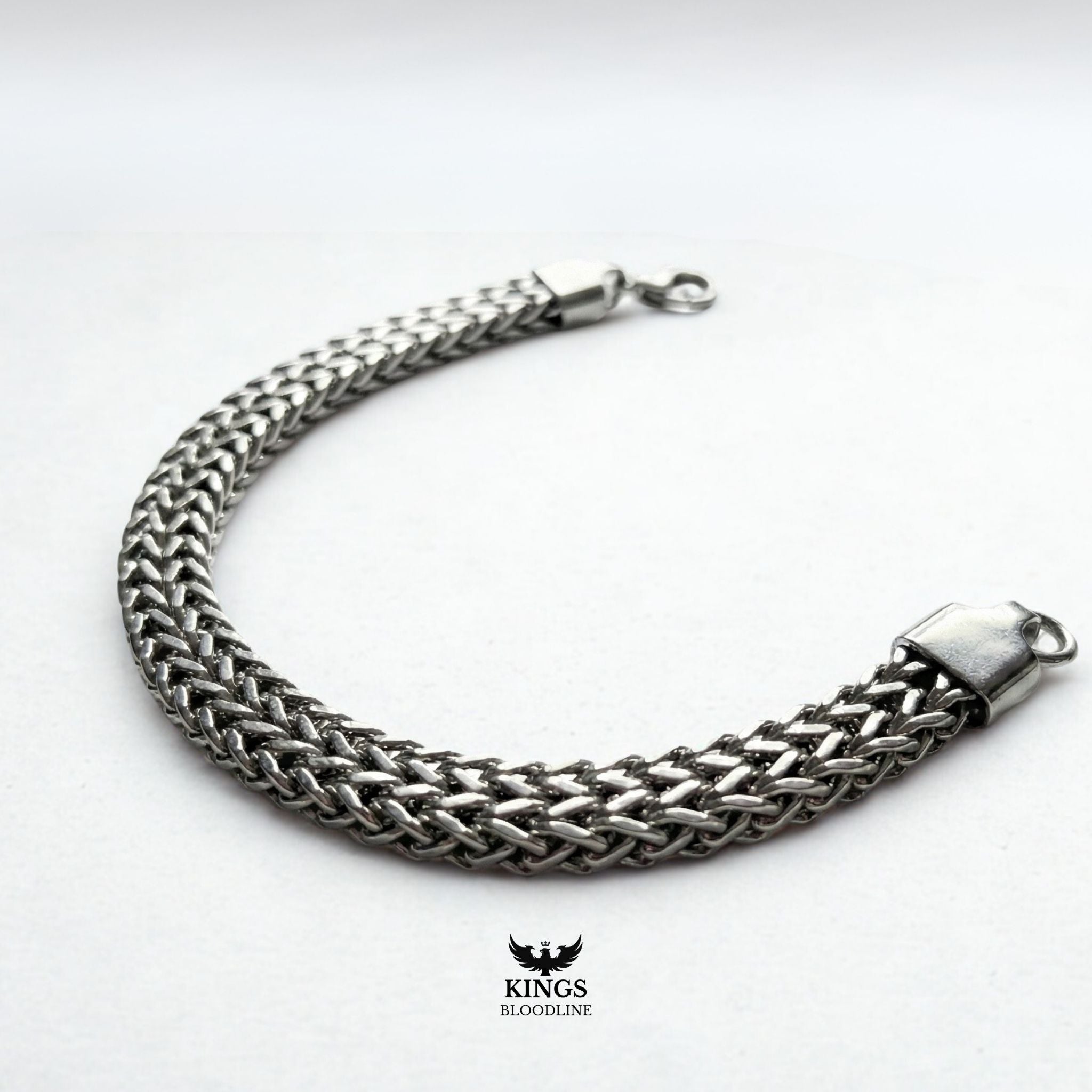 Titanium steel bracelet on white background side view