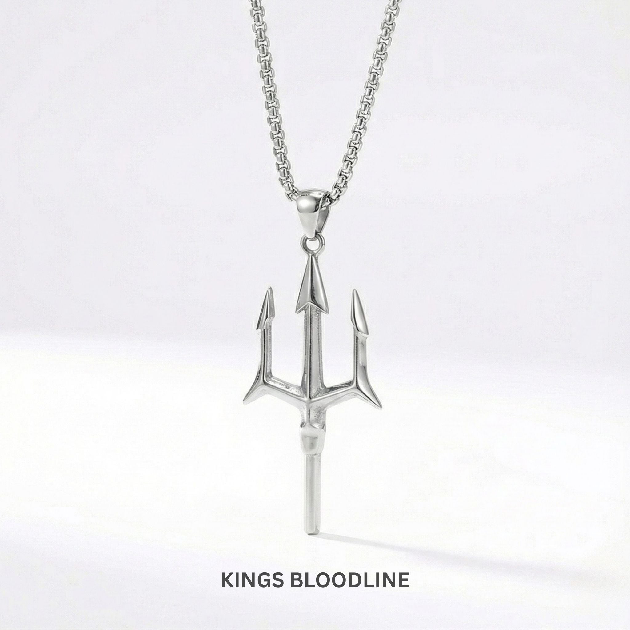 Silver trident pendant necklace on a white background with 'Kings Bloodline' branding.